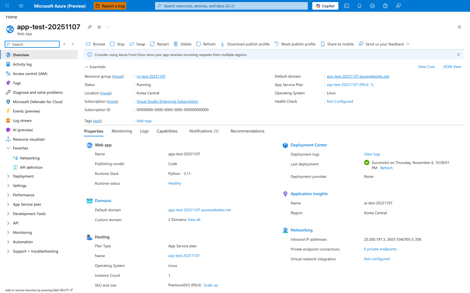 Azure portal Overview blade for app-test-20251107 (Web App) with a command bar (Browse, Stop, Swap, Restart, Delete, Refresh, Download publish profile, Reset publish profile, Share to mobile, Send us your feedback) and an Essentials panel showing Resource group rg-test-20251107, Status Running, Location Korea Central, Subscription Visual Studio Enterprise Subscription, Subscription ID 00000000-0000-0000-0000-000000000000, Default domain app-test-20251107.azurewebsites.net, App Service Plan asp-test-20251107 (P0v3: 1), Operating System Linux, and Health Check Not Configured. The Properties tab is selected (next to Monitoring, Logs, Capabilities, Notifications (1), Recommendations) and surfaces Web app (Publishing model: Code, Runtime Stack: Python - 3.11, Runtime status: Healthy), Domains (2 Domains View all), Hosting (Plan Type: App Service plan, Instance Count: 1, SKU and size: Premium0V3 (P0v3) with Scale up link), Deployment Center (Last deployment: Successful on Thursday, November 6, 10:58:01 PM, Deployment provider: None), Application Insights (Name: ai-test-20251107, Region: Korea Central), and Networking (Inbound IP addresses: 20.200.197.3, 2603:1040:f05:3::208, Private endpoint connections: 0 private endpoints, Virtual network integration: Not configured). Left nav under the search box lists Overview (selected), Activity log, Access control (IAM), Tags, Diagnose and solve problems, Microsoft Defender for Cloud, Events (preview), Log stream, AI (preview), Resource visualizer, with collapsed groups Deployment, Settings, Performance, App Service plan, Development Tools, API, Monitoring, Automation, and Support + troubleshooting.