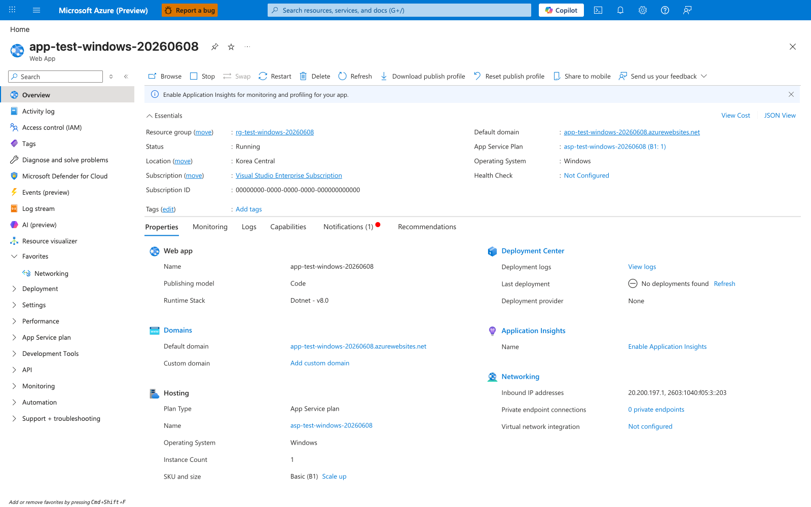 Azure portal Overview blade for the app-test-windows-20260608 Web App. The top command bar shows Browse, Stop, Swap, Restart, Delete, Refresh, Download publish profile, Reset publish profile, Share to mobile, Send us your feedback. The Essentials section lists Resource group rg-test-windows-20260608, Status Running, Location Korea Central, Subscription Visual Studio Enterprise Subscription, Subscription ID 00000000-0000-0000-0000-000000000000 (PII masked), Default domain app-test-windows-20260608.azurewebsites.net, App Service Plan asp-test-windows-20260608 (B1: 1), Operating System Windows, Health Check Not Configured. The Properties tab is selected, showing a Web app card with Name app-test-windows-20260608, Publishing model Code, Runtime Stack Dotnet - v8.0, and a Hosting card with Plan Type App Service plan, Name asp-test-windows-20260608, Operating System Windows, Instance Count 1, SKU and size Basic (B1). The left navigation rail lists Overview, Activity log, Access control (IAM), Tags, Diagnose and solve problems, Microsoft Defender for Cloud, Events (preview), Log stream, AI (preview), Resource visualizer, Networking, Deployment, Settings, Performance, App Service plan, Development Tools, API, Monitoring, Automation, Support + troubleshooting.